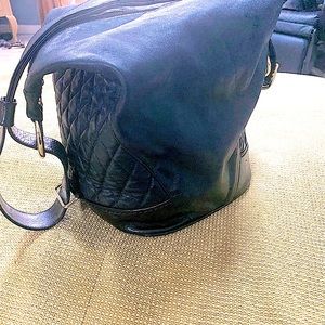 Marino Orlandi black leather bucket sling bag with gold accents